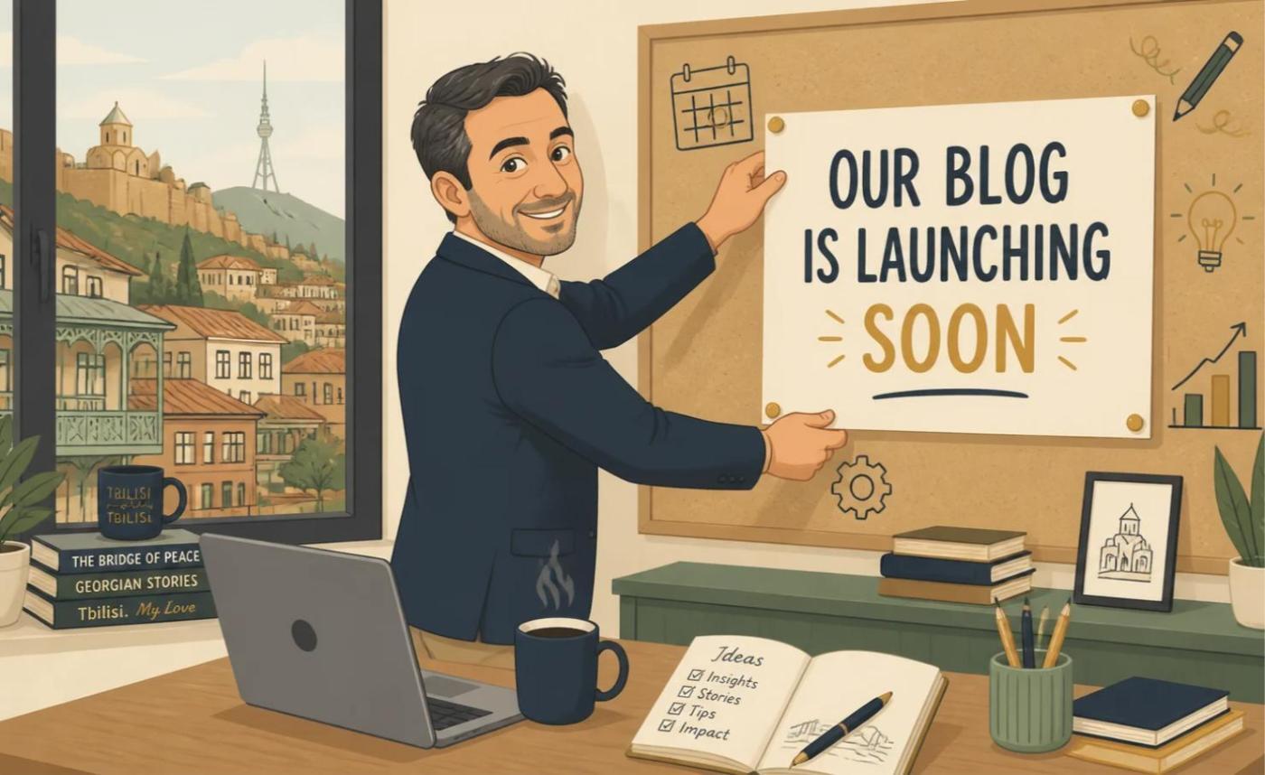 Cartoon of Shalva Berianidze pinning an 'Our blog is launching soon' sign in his Tbilisi office